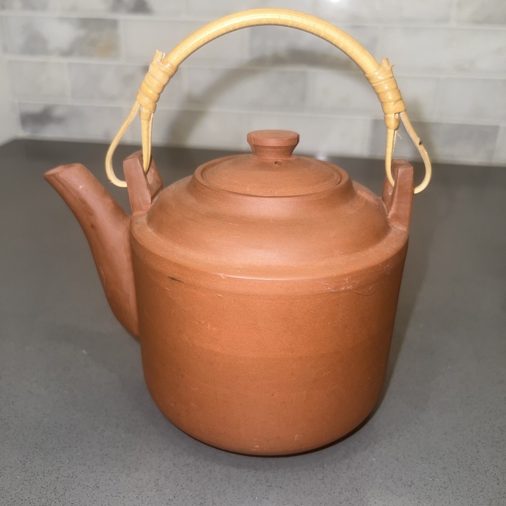 terra-cotta clay teapot made in China with bamboo handle